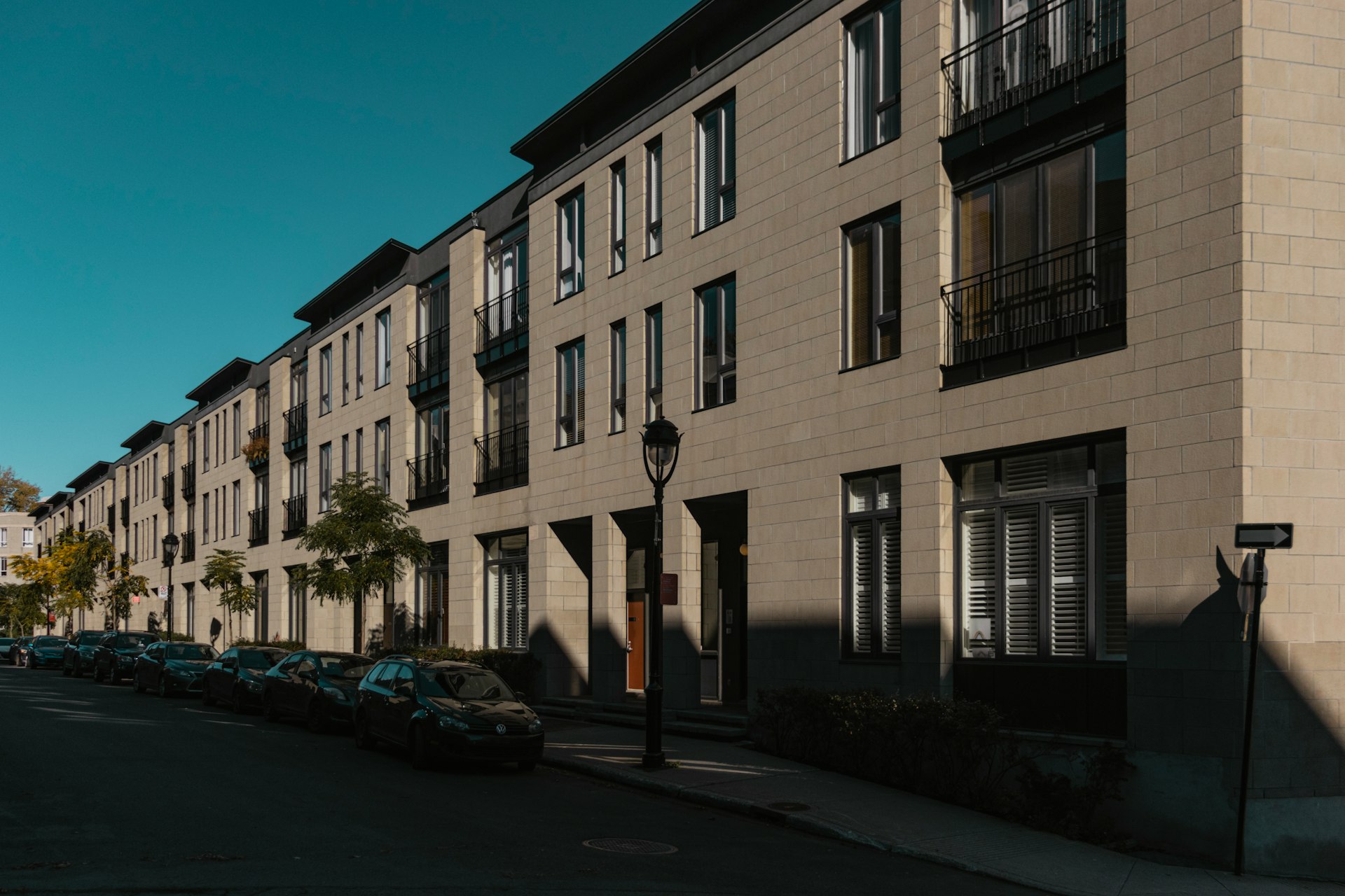 cars parked in front of building during daytime